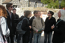 Image of tour guide with school kids